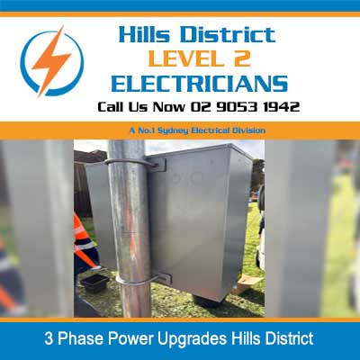 Level 2 electrician working on outdoor electrical equipment for 3 phase power upgrades in Hills District