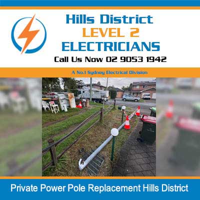 New power pole replacement with safety cones at residential property in Hills District